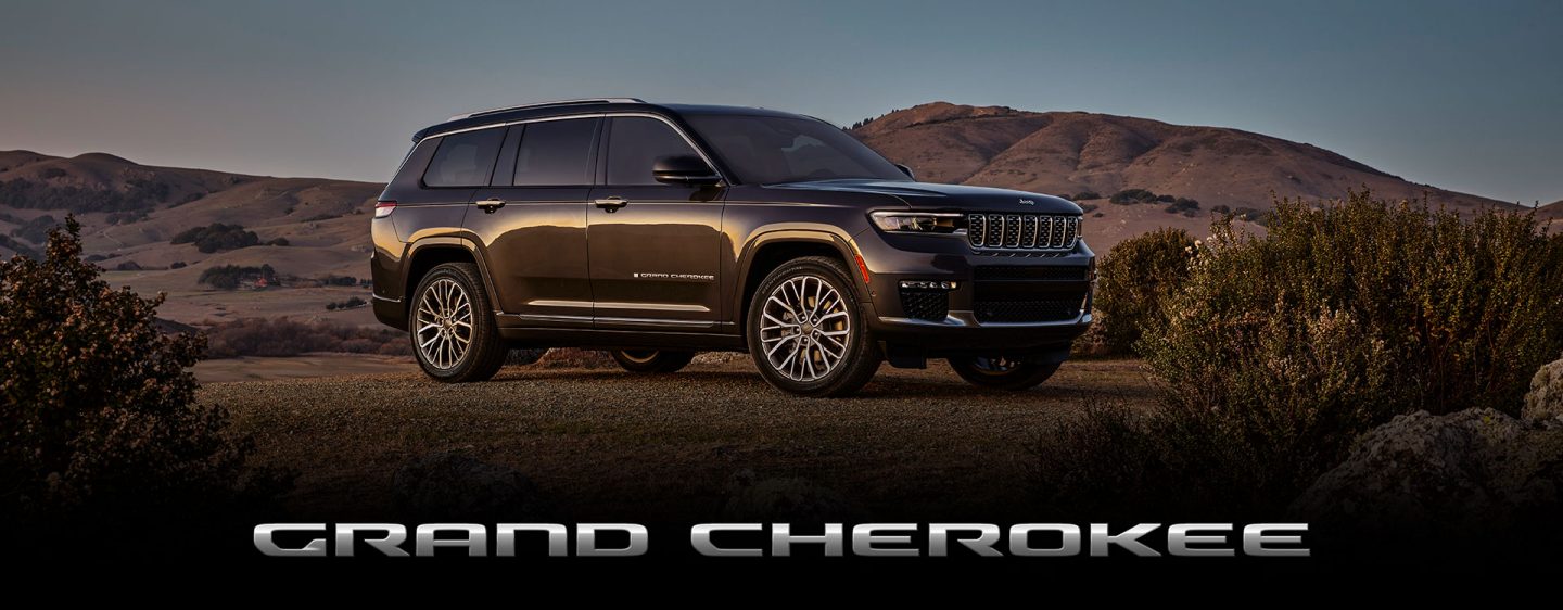 The 2023 Jeep Grand Cherokee Summit Reserve parked in a desert setting.