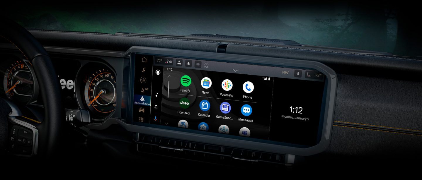 A close-up of the Uconnect 5 touchscreen in the 2024 Jeep Wrangler displaying a series of Android Auto selections and the current date and time.